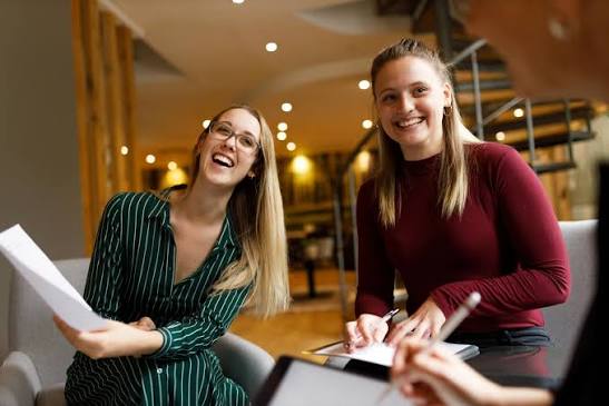 two ladies smiling